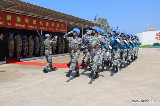 Chinese peacekeepers march during a medal ceremony held at the Chinese troop's camp in Hanniyah village in southern Lebanon, on April 3, 2019. Chinese peacekeepers at the UN Interim Force in Lebanon (UNIFIL) received UN medal Wednesday for their contribution to keeping peace in southern Lebanon. (Photo/Xinhua)