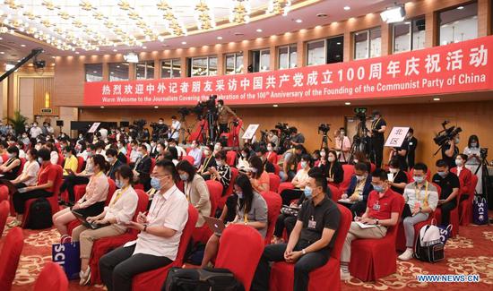 The Press Center for Celebration of the 100th Anniversary of the Founding of the Communist Party of China (CPC) holds its first press conference in Beijing, capital of China, June 27, 2021. Qu Qingshan, head of the Institute of Party History and Literature of the CPC Central Committee, attended the press conference with other senior researchers on the history of the CPC. (Xinhua/Ren Chao)