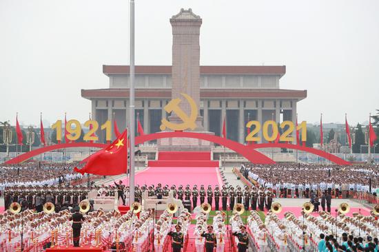 The national flag is raised in a grand ceremony to celebrate the centenary of the Communist Party of China at Tian'anmen Square in Beijing, July 1, 2021. [Photo/Xinhua] 