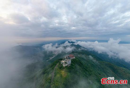 Mist and cloud hover over Huaying Mountain in Sichuan