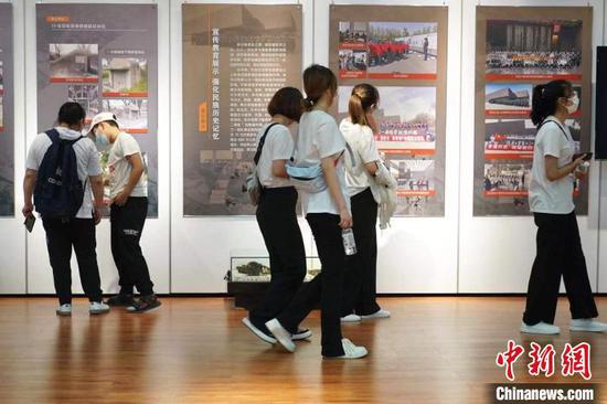 People visit the exhibition about the conservation achievements of Unit 731 in Harbin, Northeast China's Heilongjiang Province. (Photo: China News Service/Lu Pin)