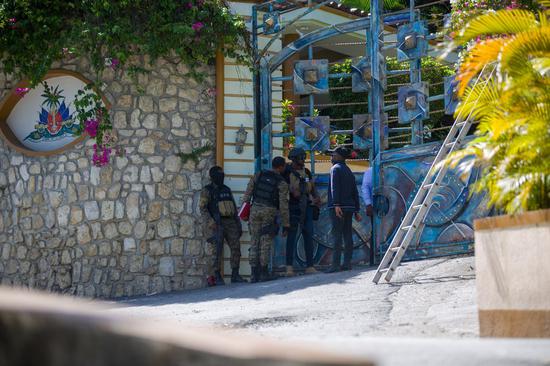 Soldiers stand at the entrance of Haitian President Jovenel Moise's home in Port-au-Prince, Haiti, on July 7, 2021. (Photo by Tcharly Coutin/Xinhua)