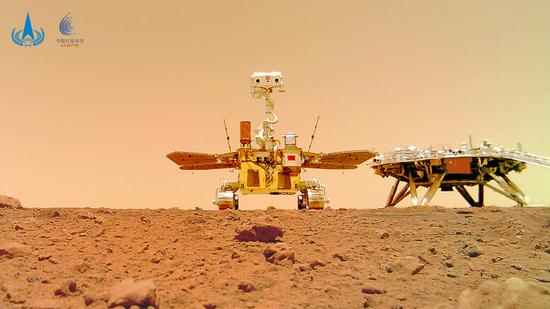 Photo released on June 11, 2021 by the China National Space Administration (CNSA) shows a selfie of China's first Mars rover Zhurong with the landing platform. （CNSA/Handout via Xinhua）