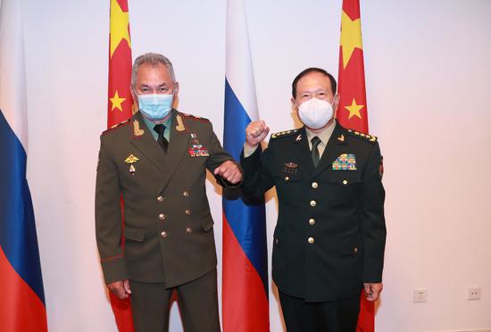 Chinese State Councilor and Minister of National Defense Wei Fenghe (R) meets Russian Defense Minister Sergei Shoigu on the sidelines of a meeting of defense ministers of the Shanghai Cooperation Organization member states in Dushanbe, Tajikistan on July 28, 2021. (Xinhua)