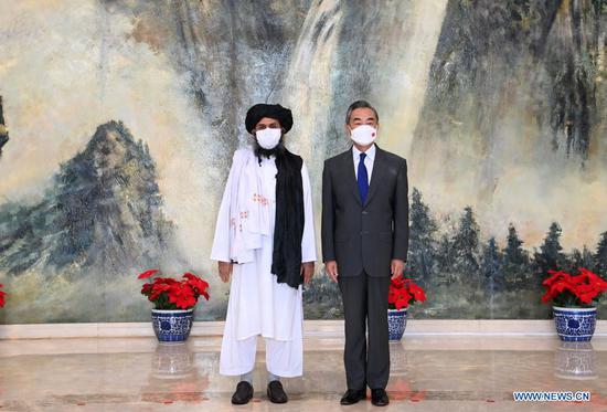Chinese State Councilor and Foreign Minister Wang Yi meets with Mullah Abdul Ghani Baradar, political chief of Afghanistan's Taliban, in Tianjin, July 28, 2021. (Photo/Xinhua)