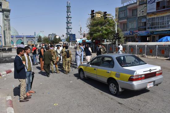 Afghan security force members inspect the site of a bomb explosion in Mazar-i-Sharif, capital of Balkh province, Afghanistan, Aug. 6, 2021. (Photo by Kawa Basharat/Xinhua)