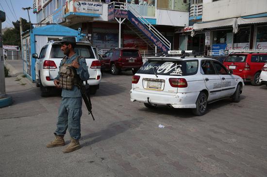 A policeman is seen at the site where Afghan senior official Dawa Khan Menapal was shot dead in Kabul, Afghanistan, on Aug. 6, 2021. (Photo by Sayed Mominzadah/Xinhua)