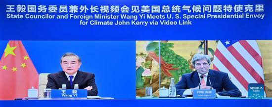 Chinese State Councilor and Foreign Minister Wang Yi meets with the U.S. Special Presidential Envoy for Climate John Kerry via video link, Sept. 1, 2021. (Xinhua/Yue Yuewei)