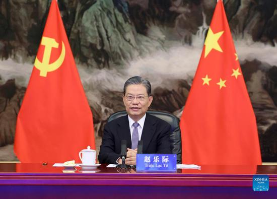 Zhao Leji, a member of the Standing Committee of the Political Bureau of the Communist Party of China (CPC) Central Committee and secretary of the CPC Central Commission for Discipline Inspection, meets with Tran Cam Tu, a member of the Politburo of the Communist Party of Vietnam (CPV) Central Committee, and head of the Committee's Inspection Commission, via video link in Beijing, capital of China, Sept. 7, 2021. (Xinhua/Ding Haitao)