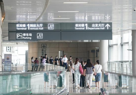 People walk to the terminal 1 of Nanjing Lukou International Airport in Nanjing, East China's Jiangsu province, July 29, 2020. (File photo/Xinhua)