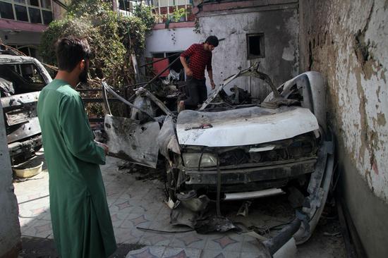 Photo taken on Sept. 2, 2021 shows damaged vehicles at the site of the U.S. airstrike in Kabul, capital of Afghanistan. (Photo by Saifurahman Safi/Xinhua)