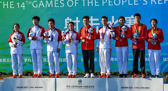 The youthfulness of China's medalists－Yang Qian/Yang Haoran (21/25 years old, gold), Wang Zhilin/Wang Yuefeng (17/23, silver) and Zhang Yu/Sheng Lihao (21/17, bronze)－in the 10-meter air rifle mixed team event at the National Games bodes well for the country's hopes of dominating the sport on the global stage. (Photo/Xinhua)