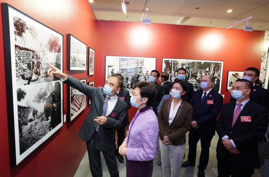 HKSAR Chief Executive Carrie Lam (L2) visits the China Album Photograph Collections Exhibition at the Hong Kong Central Library in south China's Hong Kong, Oct. 8, 2021. (Xinhua/Liu Sui Wai)