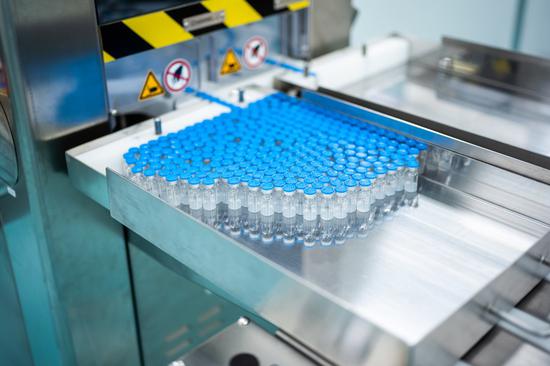 Vials are seen during the fill and finish operation for Sinovac vaccines at Malaysian pharmaceutical company Pharmaniaga on the outskirts of Kuala Lumpur, Malaysia, Oct. 5, 2021. (Xinhua/Zhu Wei)