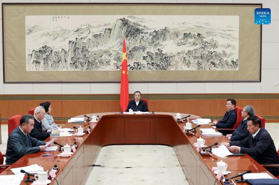 Chinese Premier Li Keqiang, a Standing Committee member of the Political Bureau of the Communist Party of China (CPC) Central Committee and the head of the national energy committee, presides over a meeting of the national energy committee in Beijing, capital of China, Oct. 9, 2021. Chinese Vice Premier Han Zheng, also a member of the Standing Committee of the Political Bureau of the CPC Central Committee and vice head of the national energy committee, attended the meeting. (Xinhua/Ding Haitao)