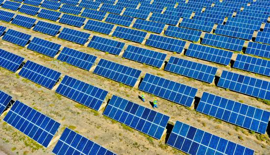 Solar panels seen near arid areas of Qilian Mountain in Northwest China. (Photo: China Daily/Wang Jiang)