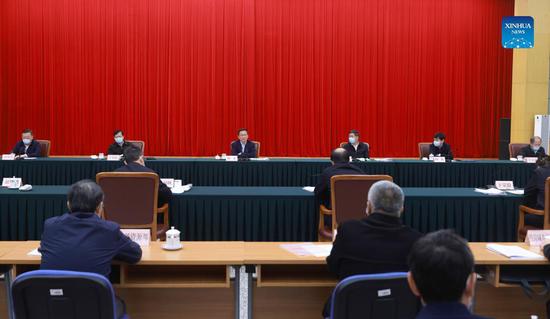 Chinese Vice-Premier Han Zheng, also a member of the Standing Committee of the Political Bureau of the Communist Party of China Central Committee, attends a meeting at the National Development and Reform Commission on Oct 19, 2021. (Photo/Xinhua)