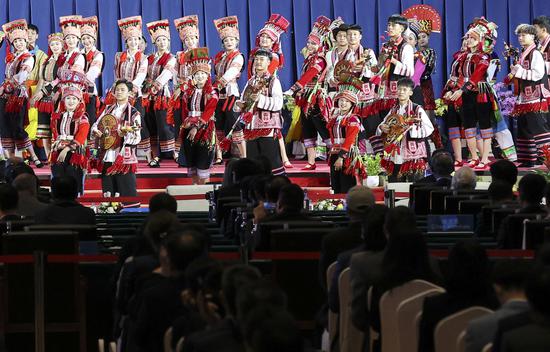 Musicians and dancers perform at the opening ceremony of the 15th meeting of the Conference of the Parties to the Convention on Biological Diversity in Kunming, capital of Yunnan province. (Photo: China Daily/Feng Yongbin)