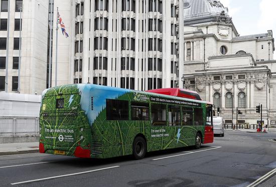 An electric bus runs on the street in London, Britain, Aug. 9, 2021. (Photo: Xinhua/Han Yan)