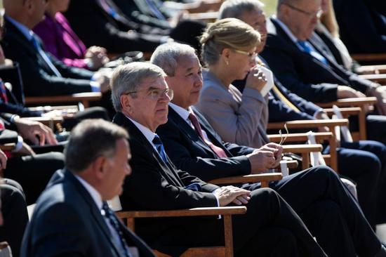 International Olympic Committee President Thomas Bach (2nd L) and special representative and Vice-President of Beijing 2022 Yu Zaiqing (3rd L) attend the Olympic flame lighting ceremony for the Beijing 2022 Winter Olympic Games, in Ancient Olympia, Greece, Oct. 18, 2021. (Xinhua/Marios Lolos)