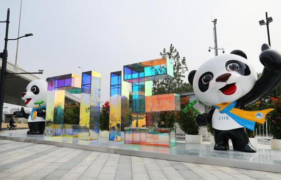 Photo taken on Oct. 22, 2021 shows decorative installations near the National Exhibition and Convention Center (Shanghai), a main venue for the fourth CIIE, in east China's Shanghai. (Photo/Xinhua)
