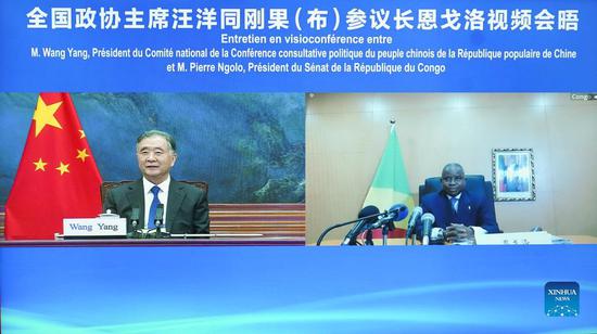Wang Yang, chairman of the Chinese People's Political Consultative Conference National Committee, meets with President of the Senate of the Republic of the Congo Pierre Ngolo via video link in Beijing, capital of China, Nov. 3, 2021. (Photo/Xinhua)