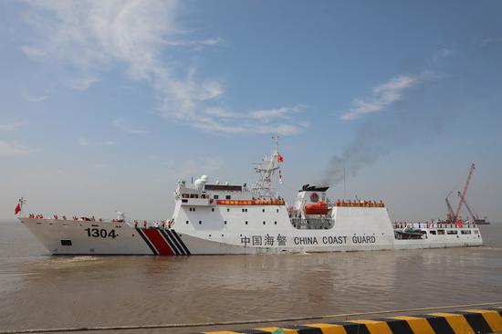 A China Coast Guard ship on a fisheries law enforcement mission in the North Pacific Ocean sets sail from Shanghai, east China, on July 30, 2021. (Xinhua)