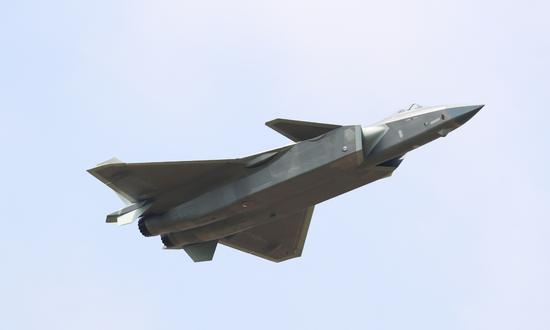 A J-20 stealth fighter jet performs aerobatics during the 13th China International Aviation and Aerospace Exhibition, or Airshow China 2021, in Zhuhai, South China's Guangdong province, Sept 28, 2021. (Photo/Xinhua)