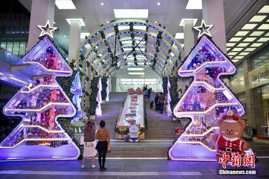 Giant Christmas decorations lit up in Hong Kong Harbour City
