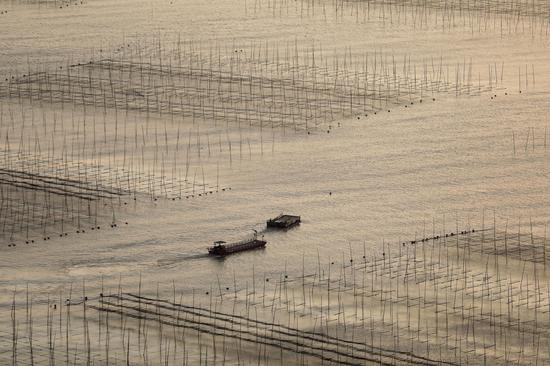 Winter fishing life under sunrise in Fujian 