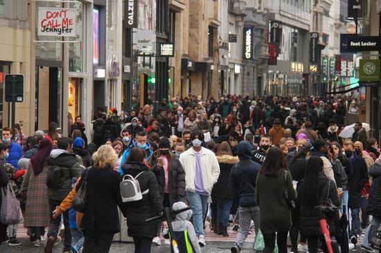 People walk on a street in Brussels, Belgium, Nov. 5, 2021. (Xinhua/Zheng Huansong)