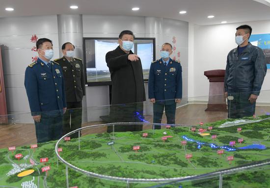 Chinese President Xi Jinping, also general secretary of the Communist Party of China (CPC) Central Committee and chairman of the Central Military Commission (CMC), learns about the education and training of soldiers and officers on Feb. 4, 2021.(Xinhua/Li Gang)