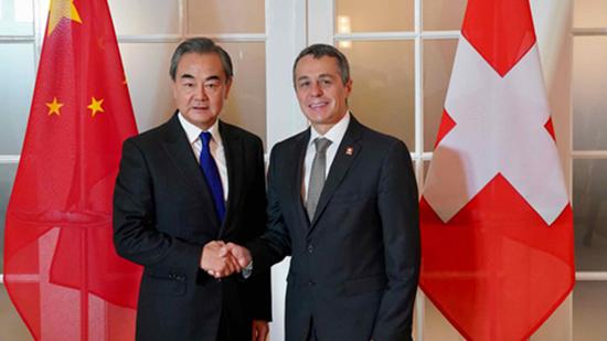 In this Oct 22, 2019 file photo, Chinese State Councilor and Foreign Minister Wang Yi shakes hand with Swiss Federal Councilor and Foreign Minister Ignazio Cassis for the second China-Switzerland Foreign Ministers' Strategic Dialogue in Berne, Switzerland. (Photo/China's Foreign Ministry)