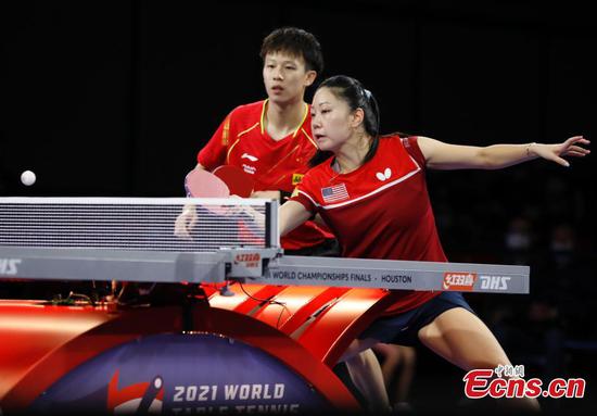Lin Gaoyuan of China (L) and Lily Zhang of the United States compete during the mixed doubles semifinal match at 2021 World Table Tennis Championships in Houston, the United States, Nov. 28, 2021. (Photo: China News Service/Liu Guanguan)