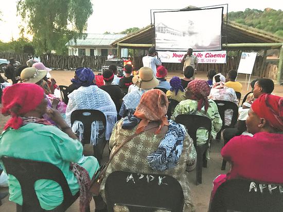 A movie is shown at a village in Botswana in 2018. (Photo/CHINA DAILY)