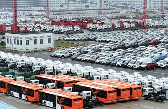 Cars, buses and trucks waiting for shipping at Waigaoqiao Port Area in Shanghai in June. (Photo: China Daily/Li Jin)