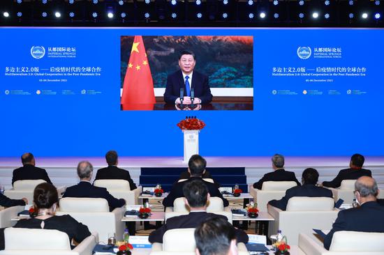 President Xi Jinping delivers a speech via video on Sunday at the opening ceremony of the 2021 Imperial Springs International Forum, held in Guangzhou, Guangdong province, with the theme 