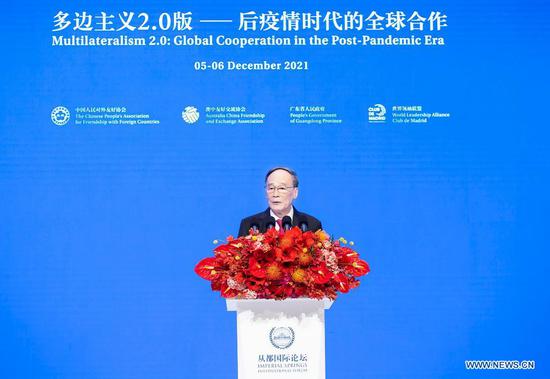 Chinese Vice President Wang Qishan addresses the opening ceremony of the 2021 Imperial Springs International Forum in Guangzhou, south China's Guangdong Province, Dec. 5, 2021. (Xinhua/Li Tao)