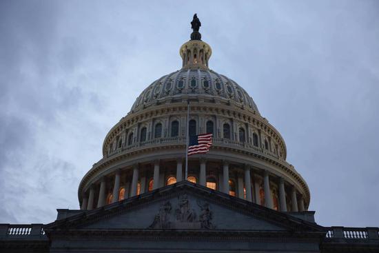 The American flag is flown at the U.S. Capitolx in Washington. (Photo/Xinhua)