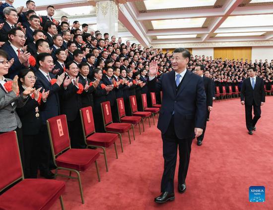 Chinese President Xi Jinping, also general secretary of the Communist Party of China (CPC) Central Committee and chairman of the Central Military Commission, meets with representatives of a meeting commending role models in implementing the Peaceful China initiative at the Great Hall of the People in Beijing, capital of China, Dec. 15, 2021. Li Keqiang, Wang Huning and Han Zheng, who are members of the Standing Committee of the Political Bureau of the CPC Central Committee, attended the event. (Xinhua/Xie Huanchi)