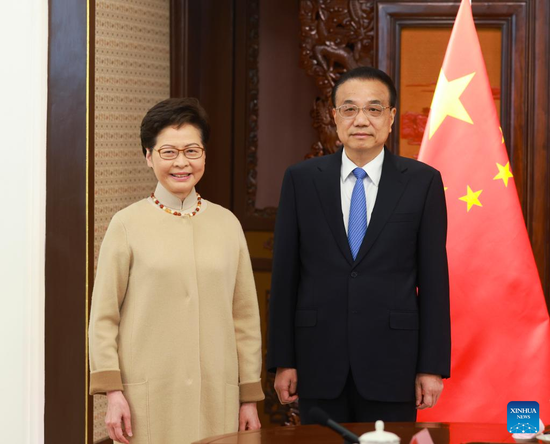 Premier Li Keqiang meets with Chief Executive of the Hong Kong Special Administrative Region (HKSAR) Carrie Lam, who is on a duty visit to Beijing, capital of China, Dec. 22, 2021. (Xinhua/Ding Lin)