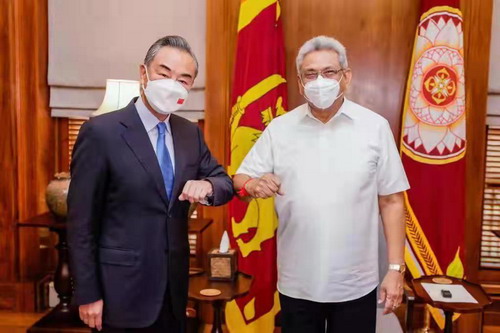 Sri Lankan President Gotabaya Rajapaksa, Chinese State Councilor and Foreign Minister Wang Yi (L) greet each other in Colombo, Sri Lanka, January 9, 2022. /China's Foreign Ministry