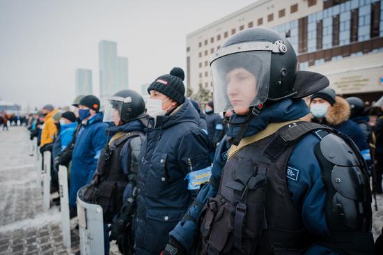 Local residents stand shoulder to shoulder with police officers in Nur-Sultan, Kazakhstan, Jan. 8, 2022. (website of Nur-sultan city hall/Handout via Xinhua)