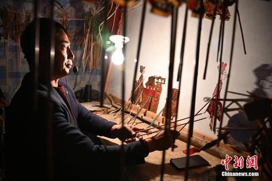 Chinese New Year behind the Shadow Puppets play in Gansu