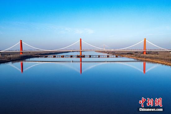 6,683-meter-long self-anchored suspension bridge opens to traffic in E China