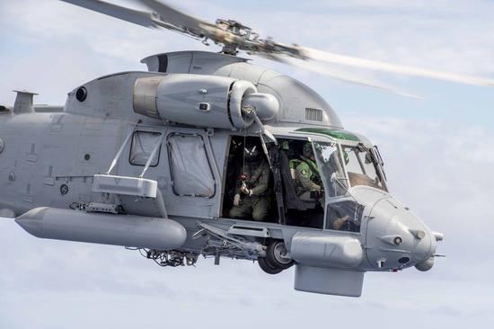 A helicopter is doing a training flight during New Zealand Navy vessel HMNZS Wellington's transit to Tonga on Jan. 19, 2022. (New Zealand Ministry of Defense/Handout via Xinhua)