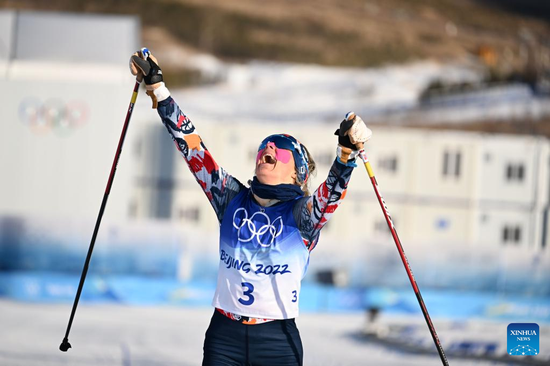 Norway's Therese Johaug celebrates after winning the Cross-Country Skiing Women's 7.5km + 7.5km Skiathlon at National Cross-Country Skiing Centre in Zhangjiakou, north China's Hebei Province, Feb. 5, 2022. (Xinhua/Mu Yu)