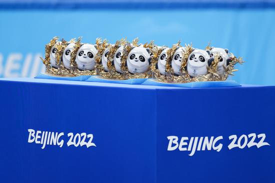Beijing 2022 mascots Bing Dwen Dwen to be awarded to medalists of the short track speed skating team mixed relay are seen before the awarding ceremony in Capital Indoor Stadium, Beijing, Feb 5, 2022. (Photo/Xinhua)