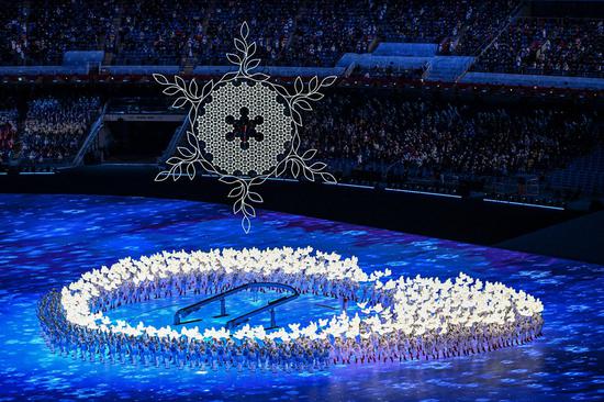 Artists perform with a cauldron holding the Olympic flame in the air during the opening ceremony of the Beijing 2022 Olympic Winter Games at the National Stadium in Beijing, capital of China, Feb. 4, 2022. (Xinhua/Wang Fei)