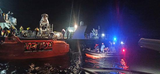 Coast Guard vessels rescue people who evacuated from the ferry in a lifeboat off Corfu island in Greece, Feb. 18, 2022. (Hellenic Coast Guard/Handout via Xinhua)